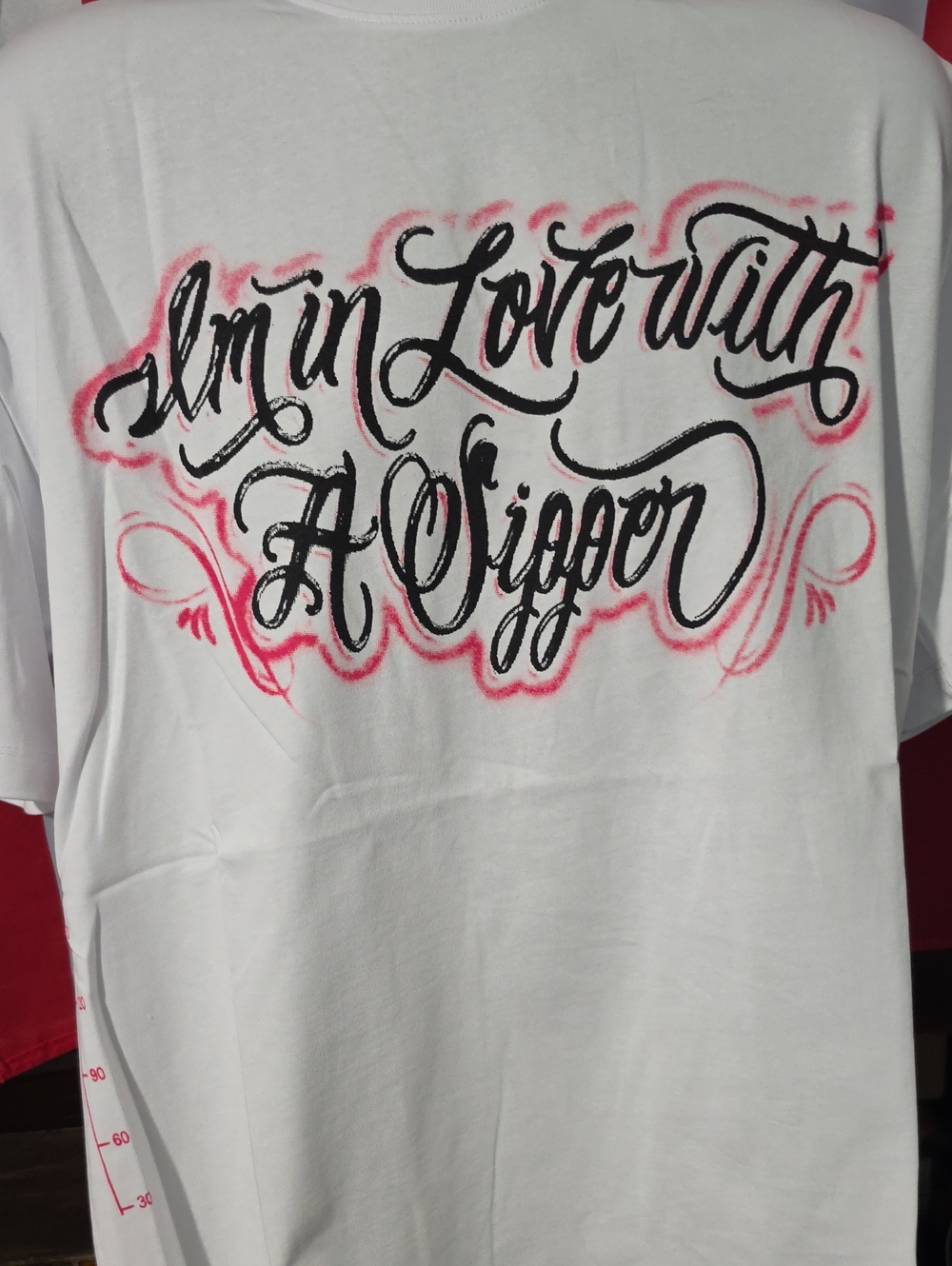 Men's White Short-Sleeve Graphic Tee with Black Script and Pink Accents